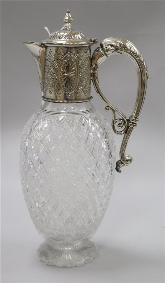 A Victorian silver plated and cut glass claret jug
